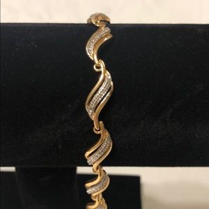 14k Gold Diamond tennis bracelet.
